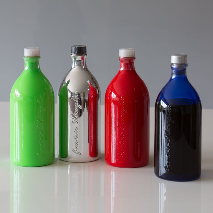 OLIVE OIL IN HAND MADE TERRACOTTA BOTTLES.